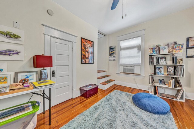 602 Allison Ave SW, Roanoke, VA 24016 - living area with wood finished floors, a ceiling fan, stairway, and baseboards