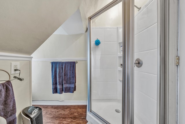 602 Allison Ave SW, Roanoke, VA 24016 - bathroom with a stall shower, wood finished floors, and vaulted ceiling