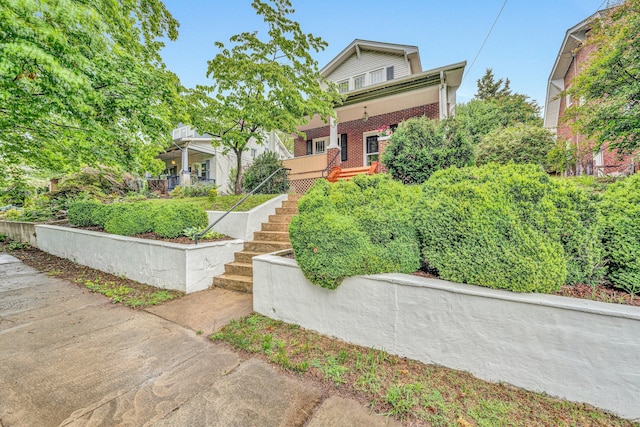 1129 Howbert Ave SW, Roanoke, VA 24015 - view of front facade with stairs and brick siding
