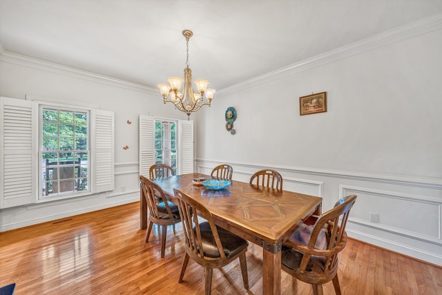 1160 Belcroft Ct, Roanoke, VA 24018 - dining area with a chandelier, crown molding, light wood-type flooring, and wainscoting