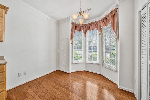 3303 Belshire Ct SW, Roanoke, VA 24014 - unfurnished dining area featuring a chandelier, light wood finished floors, baseboards, and crown molding