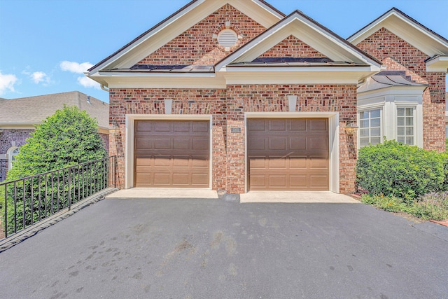 3303 Belshire Ct SW, Roanoke, VA 24014 - view of front of home featuring brick siding, asphalt driveway, and an attached garage