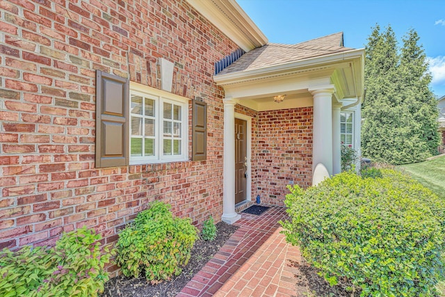 3303 Belshire Ct SW, Roanoke, VA 24014 - view of exterior entry with brick siding and a shingled roof