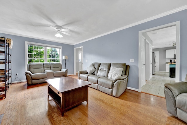 135 Sapphire Ave, Christiansburg, VA 24073 - living area featuring ceiling fan, light wood finished floors, and baseboards