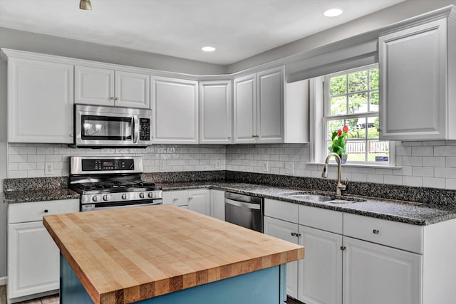 135 Sapphire Ave, Christiansburg, VA 24073 - kitchen featuring appliances with stainless steel finishes, butcher block counters, a sink, white cabinetry, and recessed lighting