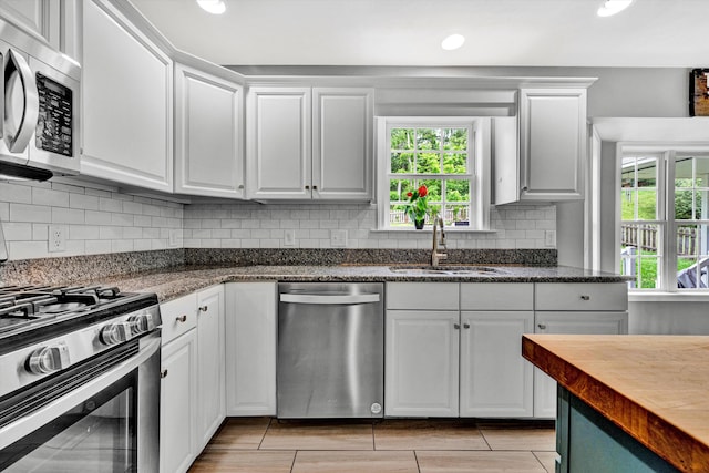 135 Sapphire Ave, Christiansburg, VA 24073 - kitchen with appliances with stainless steel finishes, a sink, healthy amount of natural light, white cabinetry, and recessed lighting