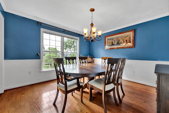 135 Sapphire Ave, Christiansburg, VA 24073 - dining area featuring crown molding, a chandelier, hardwood / wood-style floors, and baseboards