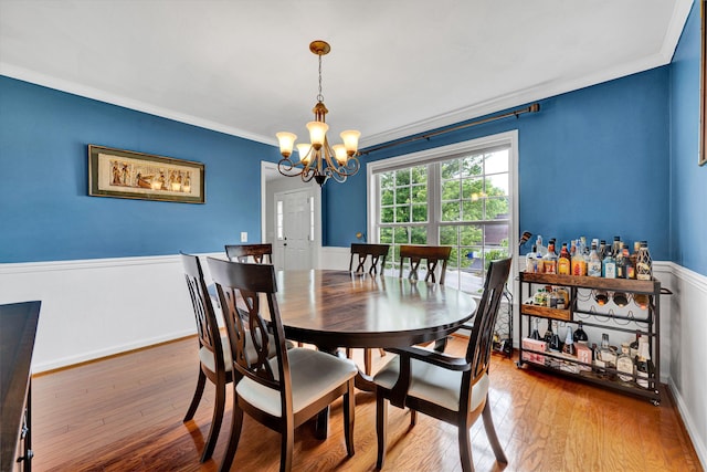 135 Sapphire Ave, Christiansburg, VA 24073 - dining area with a chandelier, hardwood / wood-style flooring, crown molding, and baseboards