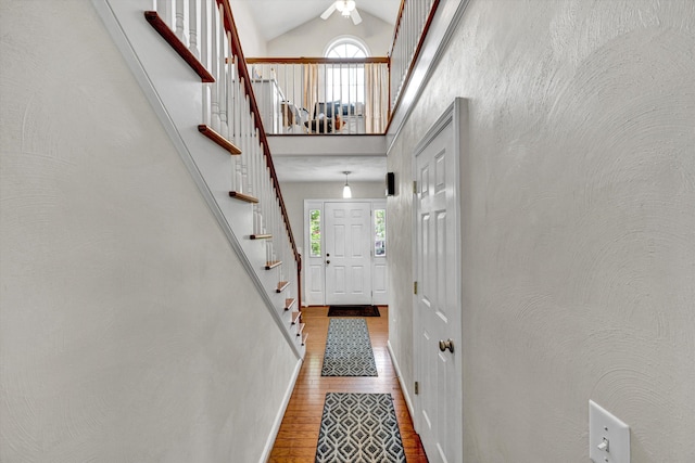135 Sapphire Ave, Christiansburg, VA 24073 - doorway to outside featuring wood finished floors, stairs, high vaulted ceiling, and ceiling fan