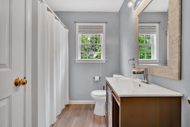 135 Sapphire Ave, Christiansburg, VA 24073 - bathroom with toilet, vanity, wood finished floors, baseboards, and curtained shower