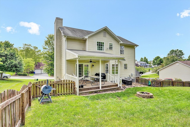 135 Sapphire Ave, Christiansburg, VA 24073 - rear view of property featuring a chimney, a fire pit, a ceiling fan, and a wooden deck