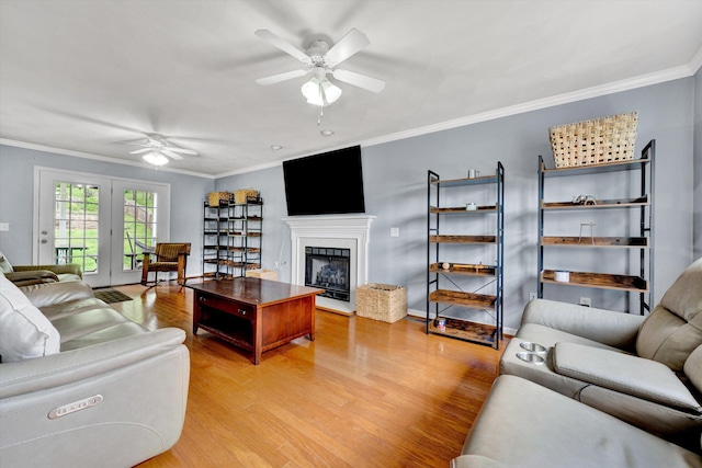 135 Sapphire Ave, Christiansburg, VA 24073 - living room with a ceiling fan, light wood finished floors, crown molding, and a fireplace