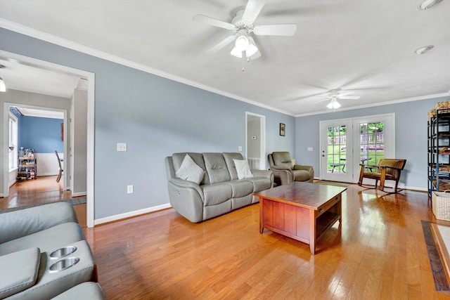 135 Sapphire Ave, Christiansburg, VA 24073 - living room featuring a ceiling fan, light wood-type flooring, baseboards, and crown molding