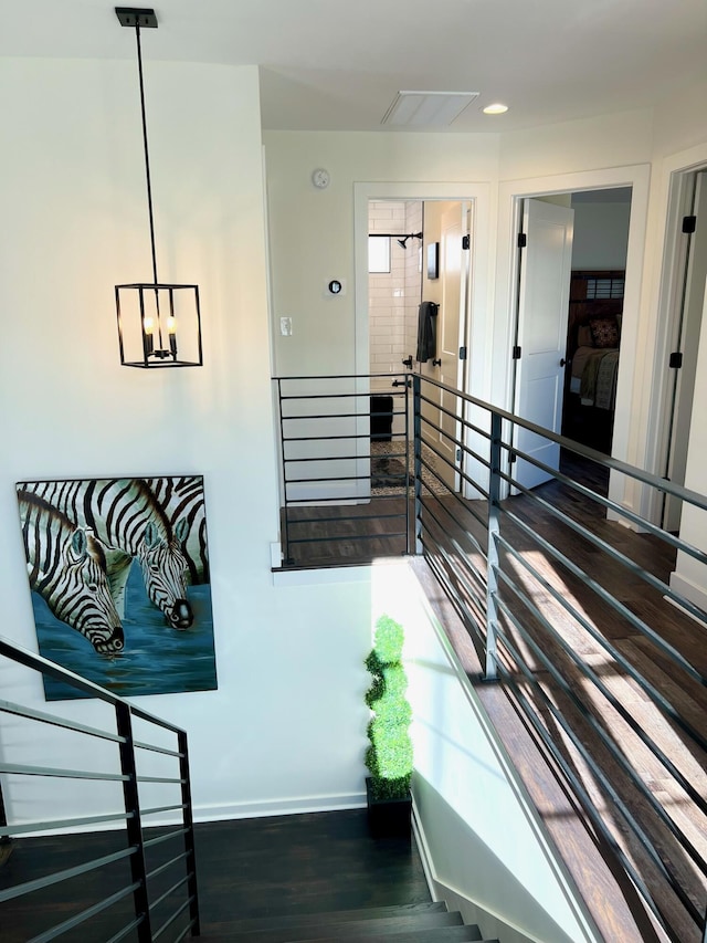 103 Retreat Ln, Huddleston, VA 24104 - stairway with wood finished floors, baseboards, and a chandelier