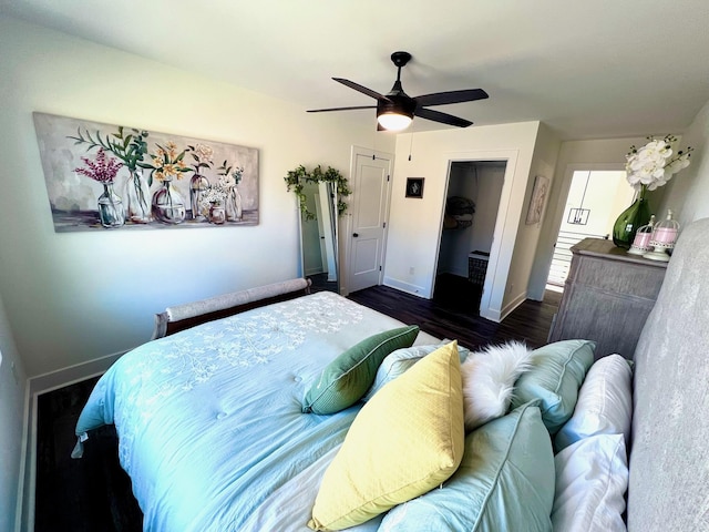 103 Retreat Ln, Huddleston, VA 24104 - bedroom with dark wood-style floors, baseboards, ceiling fan, and a closet