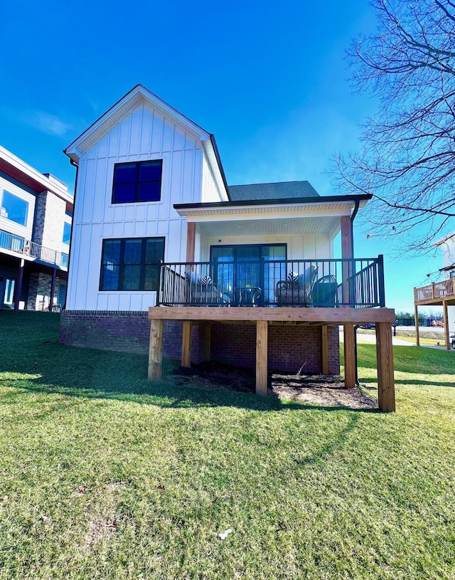 103 Retreat Ln, Huddleston, VA 24104 - rear view of house with board and batten siding, a lawn, and a wooden deck