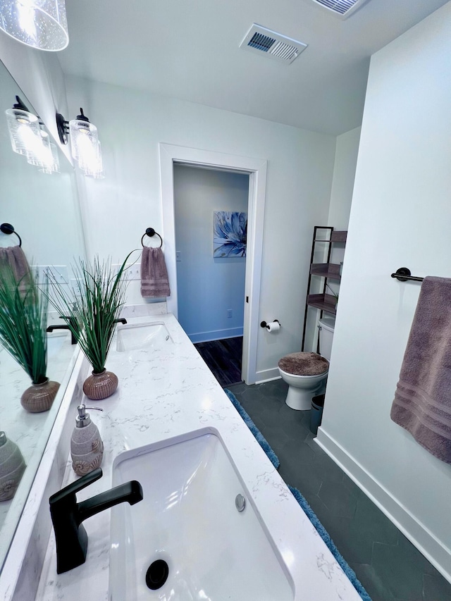 103 Retreat Ln, Huddleston, VA 24104 - bathroom featuring toilet, baseboards, and double vanity