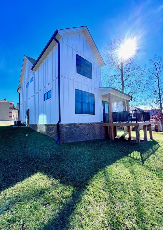 103 Retreat Ln, Huddleston, VA 24104 - view of property exterior featuring board and batten siding, a deck, a yard, and central AC unit