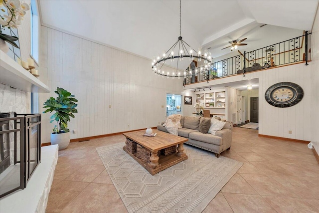 20728 Virgil H Goode Hwy, Rocky Mount, VA 24151 - living room featuring light tile patterned floors, baseboards, ceiling fan, a chandelier, and wooden walls