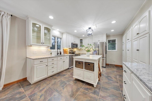 20728 Virgil H Goode Hwy, Rocky Mount, VA 24151 - kitchen with appliances with stainless steel finishes, baseboards, tasteful backsplash, recessed lighting, and glass insert cabinets