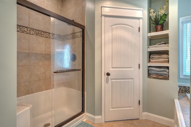 317 Cumberland Gap Rd, Newport, VA 24128 - full bathroom with a shower with shower door, baseboards, a tub to relax in, and tile patterned flooring