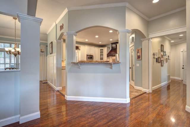 317 Cumberland Gap Rd, Newport, VA 24128 - kitchen featuring ornate columns, custom exhaust hood, wood-type flooring, glass insert cabinets, and recessed lighting