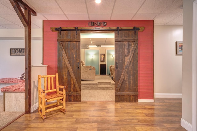 317 Cumberland Gap Rd, Newport, VA 24128 - hall featuring a barn door, a paneled ceiling, baseboards, and wood finished floors