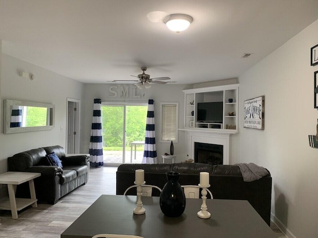 1175 Mariners Way Unit 58, Huddleston, VA 24104 - living area with plenty of natural light, a fireplace, ceiling fan, and light wood-style flooring