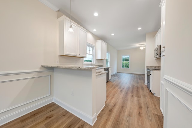 5247 Arrowhead Trl, Salem, VA 24153 - kitchen featuring stainless steel appliances, white cabinets, light wood-type flooring, recessed lighting, and a sink
