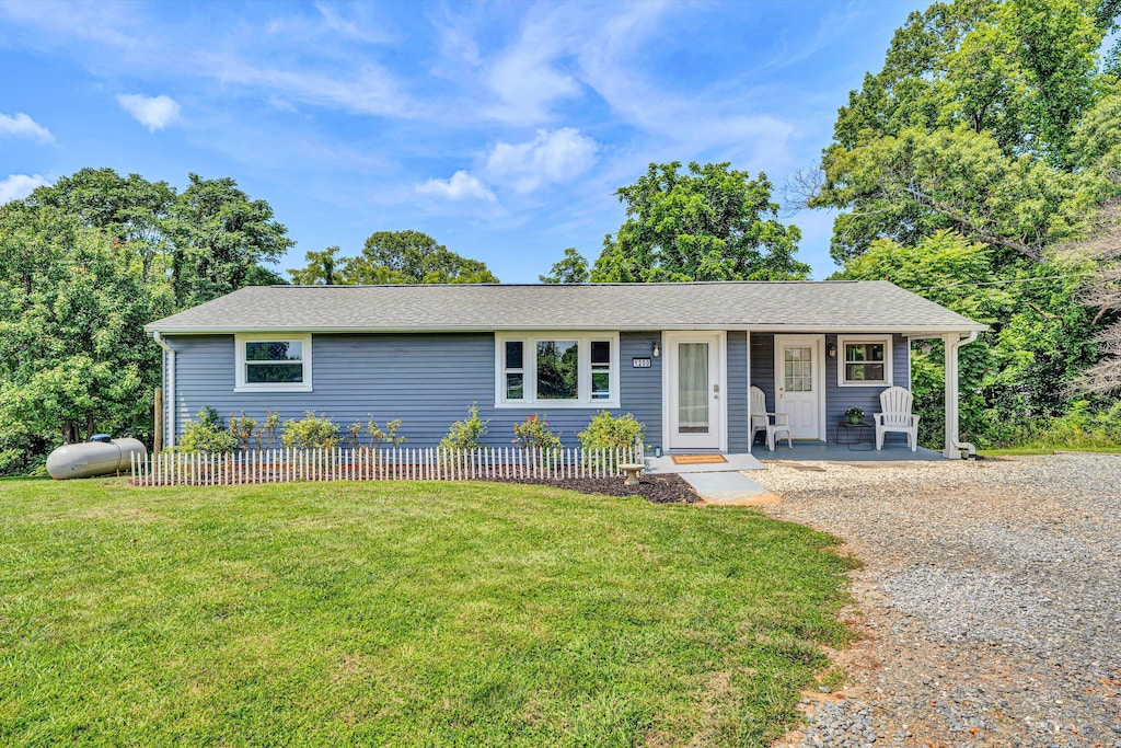 1200 Rock Spring Rd, Goodview, VA 24095 - single story home featuring a front lawn, covered porch, and roof with shingles