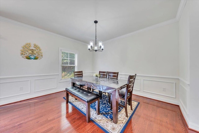 7019 Linn Cove Ct, Roanoke, VA 24018 - dining area with a chandelier, ornamental molding, wood finished floors, wainscoting, and a decorative wall