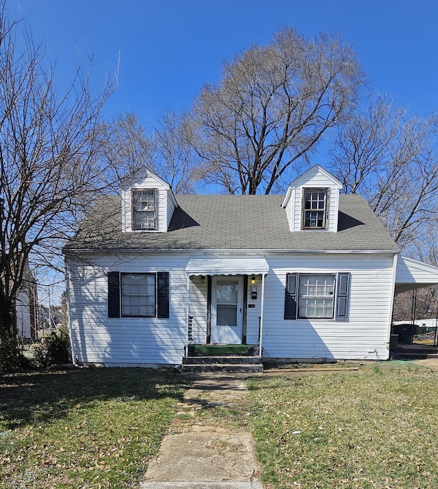 1017 Curtis Ave NW, Roanoke, VA 24012 - cape cod house featuring a front yard and an attached carport