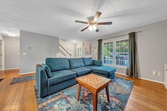 828 Ray St, Roanoke, VA 24019 - living room with stairs, a ceiling fan, baseboards, and wood finished floors