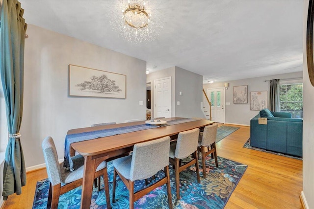 828 Ray St, Roanoke, VA 24019 - dining area with stairway, light wood-type flooring, and baseboards
