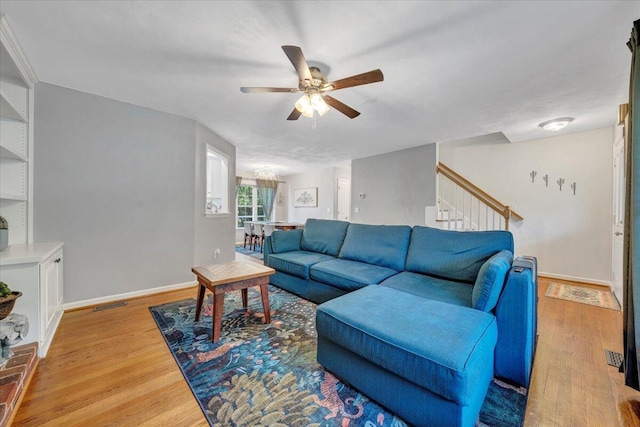 828 Ray St, Roanoke, VA 24019 - living room with a ceiling fan, light wood finished floors, stairs, and baseboards