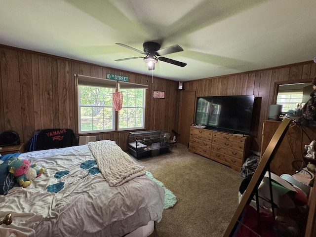570 Scuffling Hill Rd, Rocky Mount, VA 24151 - bedroom with carpet, wood walls, multiple windows, and ceiling fan