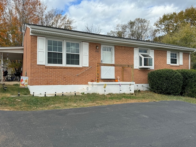 570 Scuffling Hill Rd, Rocky Mount, VA 24151 - view of front of home with brick siding and an attached carport