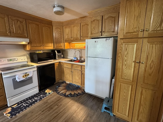570 Scuffling Hill Rd, Rocky Mount, VA 24151 - kitchen with black appliances, under cabinet range hood, a sink, dark wood-style floors, and light countertops
