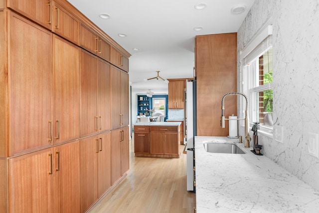 2561 Inglewood Rd SW, Roanoke, VA 24015 - kitchen featuring a sink, light wood-style flooring, freestanding refrigerator, light stone counters, and recessed lighting