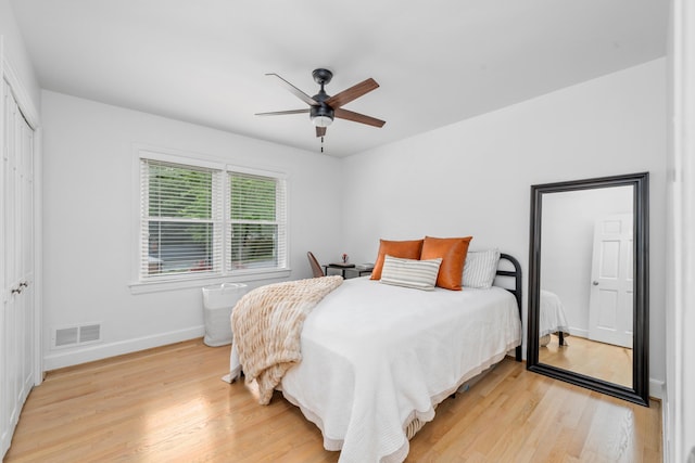 2561 Inglewood Rd SW, Roanoke, VA 24015 - bedroom with light wood-style floors, baseboards, a ceiling fan, and a closet