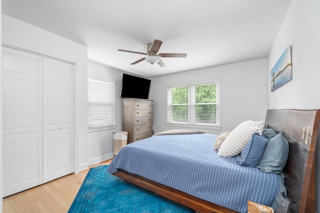 2561 Inglewood Rd SW, Roanoke, VA 24015 - bedroom with light wood-style flooring, a closet, and a ceiling fan
