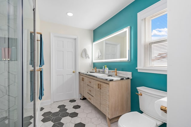 2561 Inglewood Rd SW, Roanoke, VA 24015 - full bathroom featuring double vanity, toilet, a stall shower, tile patterned floors, and recessed lighting