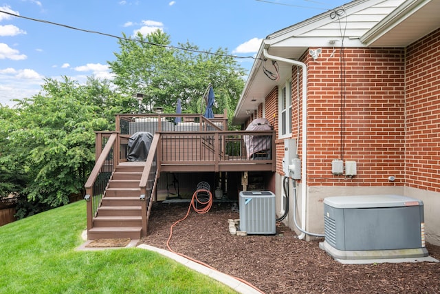 2561 Inglewood Rd SW, Roanoke, VA 24015 - wooden deck featuring central air condition unit, stairs, and a lawn