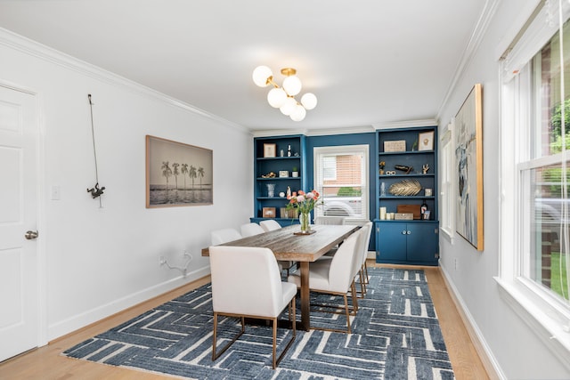 2561 Inglewood Rd SW, Roanoke, VA 24015 - dining room with wood finished floors, crown molding, a chandelier, baseboards, and built in shelves