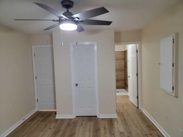 640 Cooks Knob Rd, Ferrum, VA 24088 - unfurnished bedroom with wood finished floors, baseboards, ensuite bathroom, and a ceiling fan