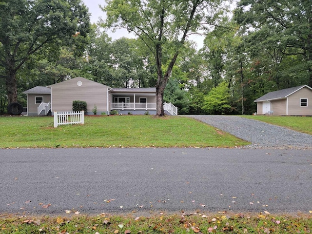 640 Cooks Knob Rd, Ferrum, VA 24088 - manufactured / mobile home with a front yard, a porch, view of wooded area, and gravel driveway