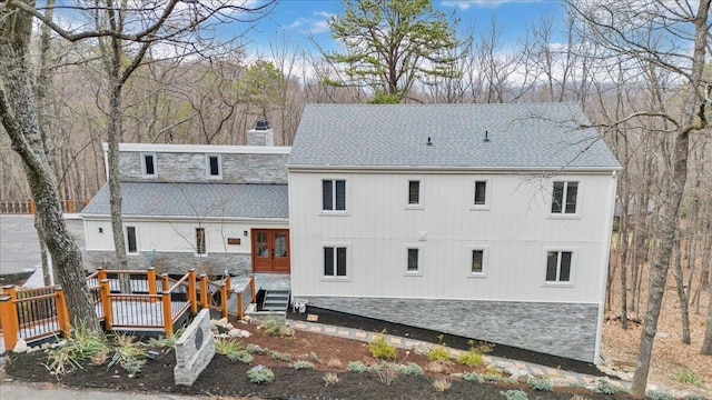 5025 Upland Game Rd, Roanoke, VA 24018 - back of property with a shingled roof, french doors, a chimney, and a deck