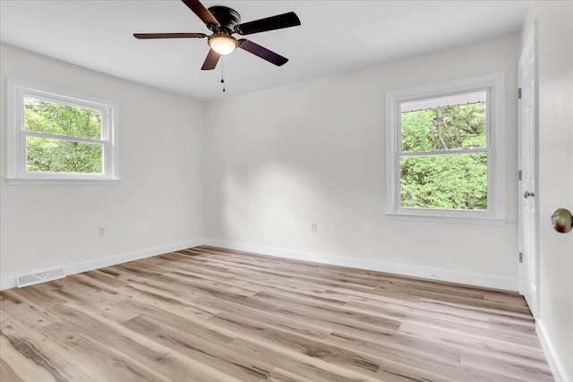 201 Forest Ridge Dr, Vinton, VA 24179 - spare room featuring plenty of natural light, light wood finished floors, baseboards, and ceiling fan