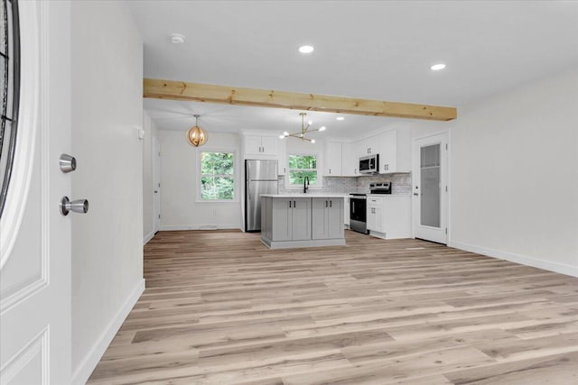 201 Forest Ridge Dr, Vinton, VA 24179 - kitchen featuring stainless steel appliances, a chandelier, recessed lighting, baseboards, and beam ceiling