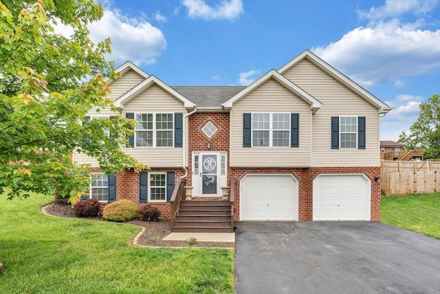 590 Keystone Dr NW, Christiansburg, VA 24073 - bi-level home featuring driveway, a garage, and brick siding
